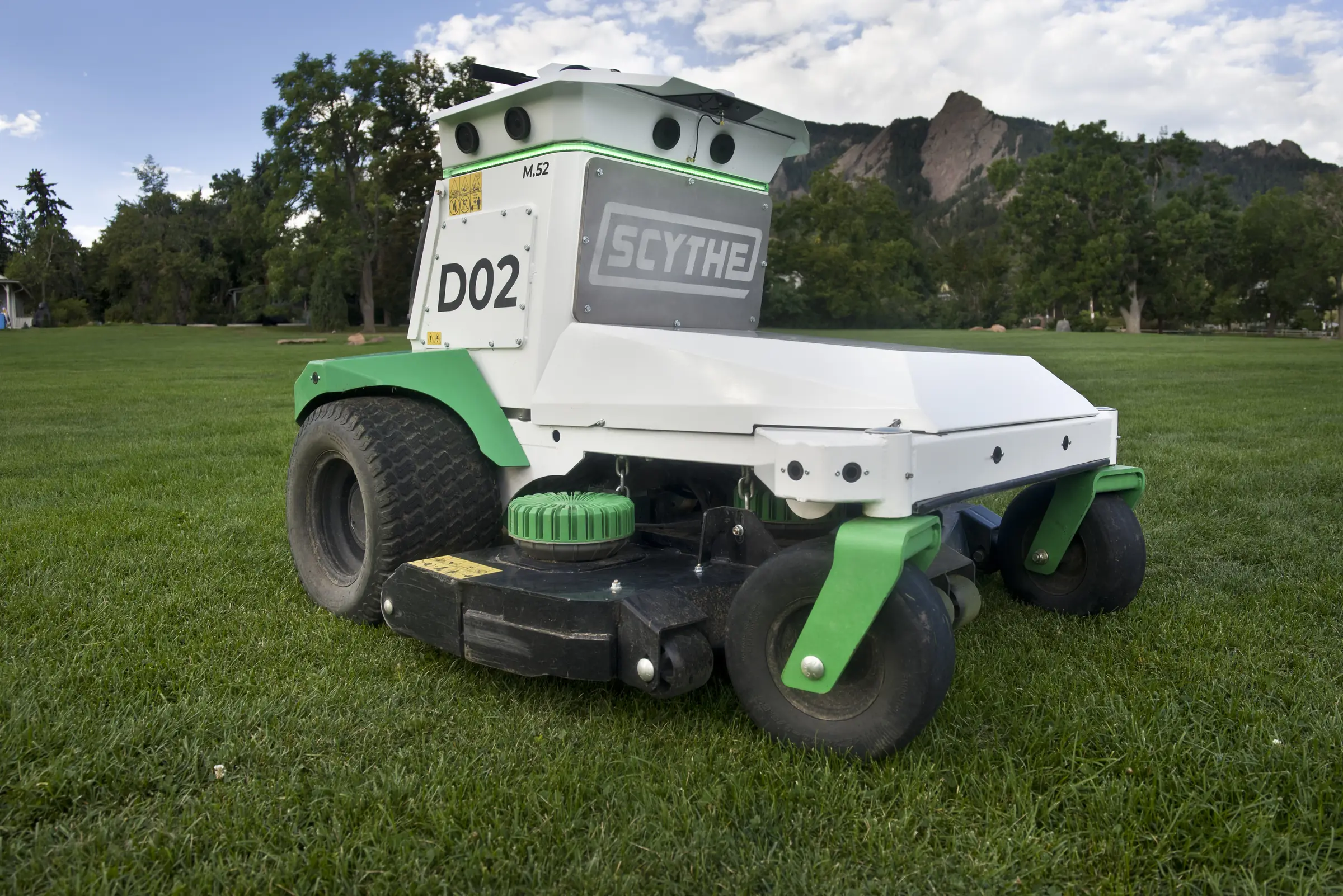 Scythe M.52 on a park lawn below the Boulder Flatirons
