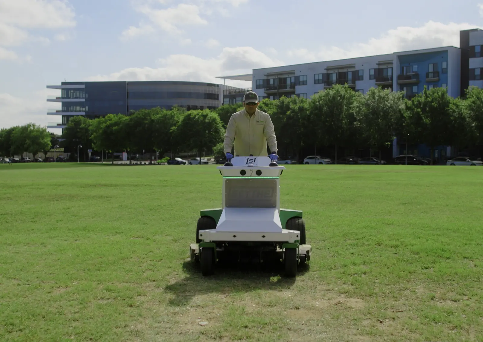 Operator driving M.52 along the edge of a lawn to map the Mow Zone