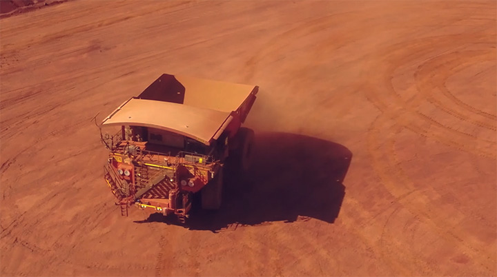 image of ultra-class haul truck driving on calibration pad